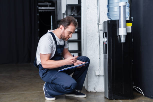 Technician repairing water dispenser